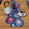 Festive flowering fireworks printed table linen, 14"x42" cutwork runner, blue, easy-care fabric.